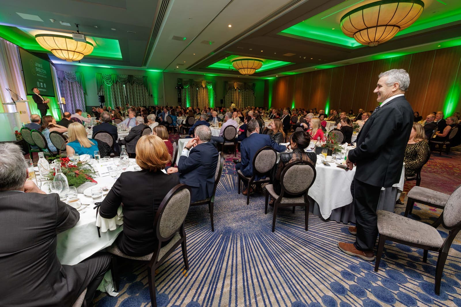 The full Lyrath Estate ballroom at the Tirlán council dinner, round tables under green light