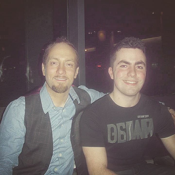 A young Jamie sits beside Derren Brown after one of Derren's theatre shows
