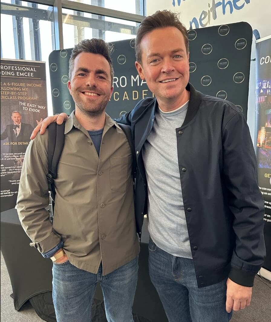 Jamie stands with Stephen Mulhern at the Pro Magic Academy stand