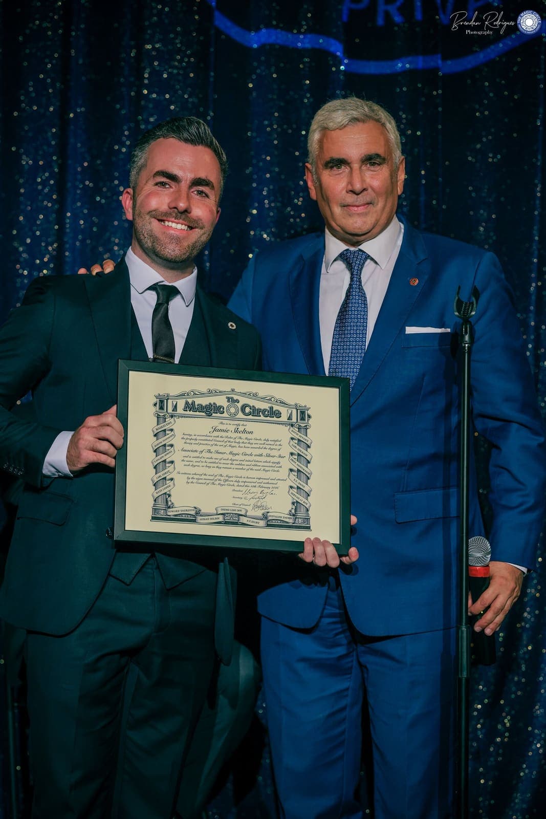 Jamie receives his Magic Circle certificate on stage from Marvin Berglas
