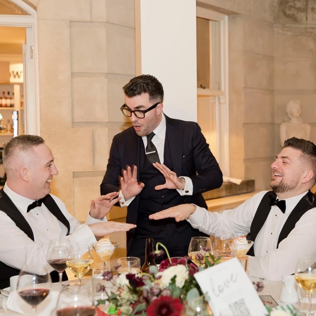 At the top table at Tankardstown House, Gavin and James laugh as Jamie, eyes wide, holds both hands up over the table